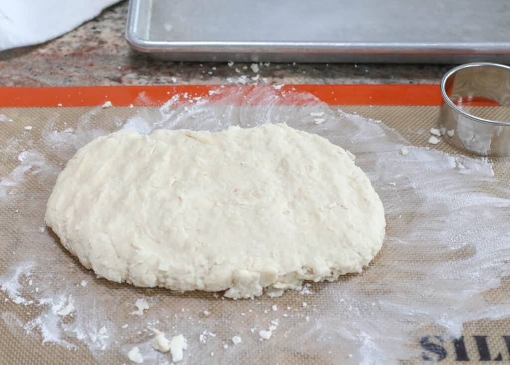 Knead or fold the dough just a few times and then pat out to 1-inch thickness.