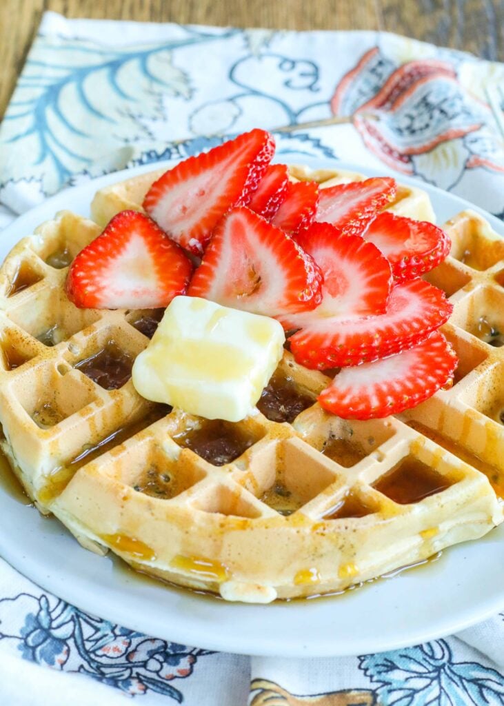 Zucchini Waffles with berries and maple syrup are a summer and fall breakfast favorite.