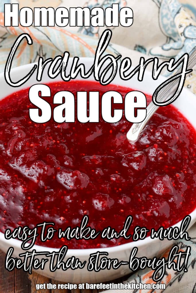 bright red cranberry sauce in white bowl with silver spoon