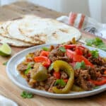Steak Fajitas made in the crockpot are a family favorite! get the recipe at barefeetinthekitchen.com