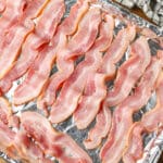 The slightly bunched up bacon with plenty of room to breathe on the sheet pan, ready to go into the oven. - 9