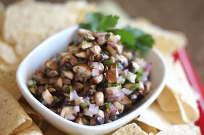 A close up of a bowl of food, with Mushroom and Salsa