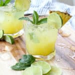 Pineapple Mojitos are a refreshing cocktail that everyone loves! get the recipe at barefeetinthekitchen.com
