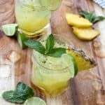Pineapple Mojitos are a favorite for all ages - the "mocktail" is every bit as delicious as the cocktail! get the recipe at barefeetinthekitchen.com