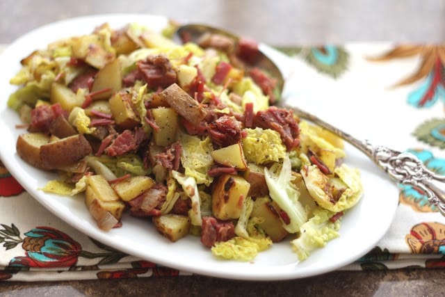 A plate of food on a table, with Potato and Bacon