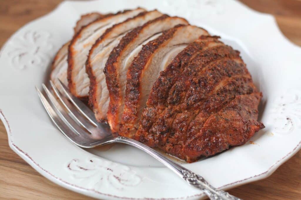 A piece of cake on a plate, with Pork and Spice rub