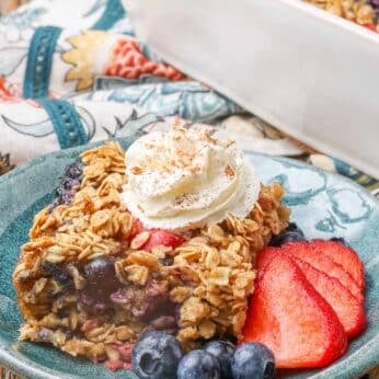 baked oatmeal with berries and whipped cream