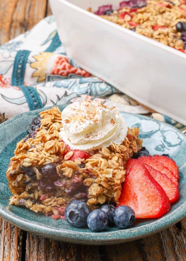 baked oatmeal with berries and whipped cream