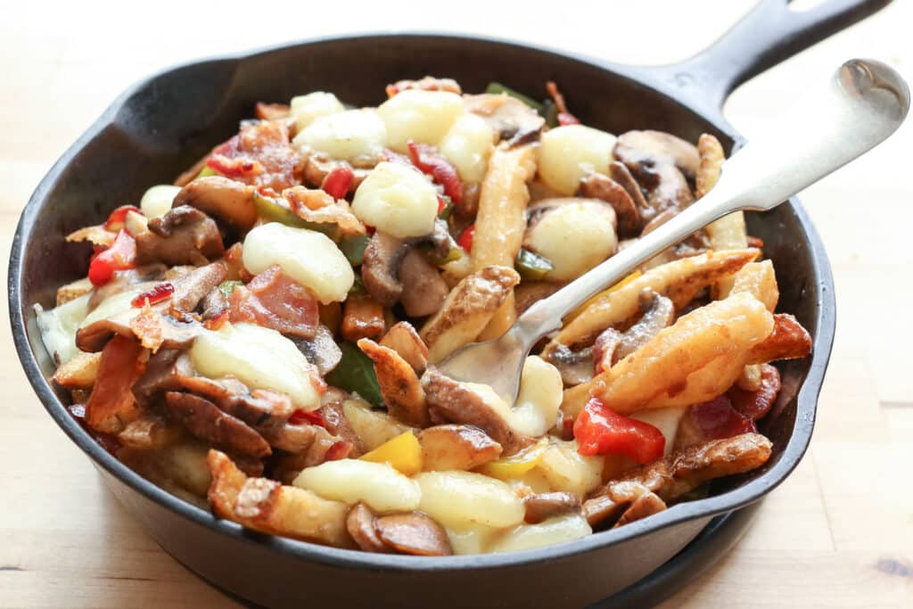 Montreal-Style Poutine with Bacon, Peppers, Mushrooms, and Onions by Barefeet In The Kitchen