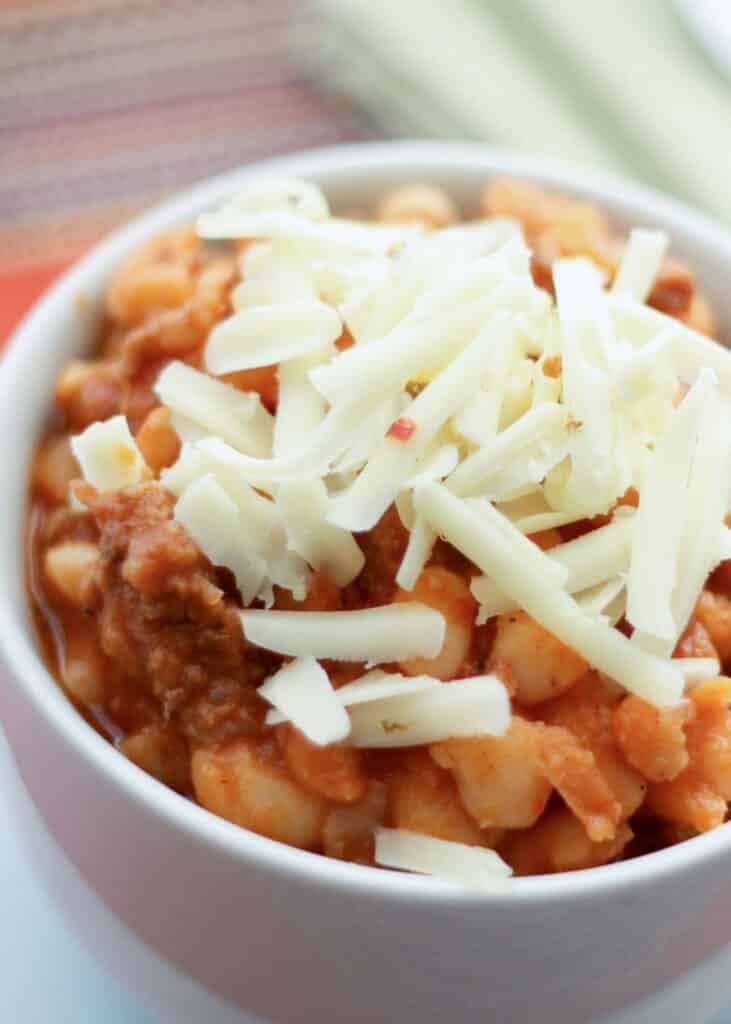 Hearty Italian Jack Chili recipe with hot and sweet Italian sausages, white beans, green chile, whiskey, and plenty of Mexican spices!