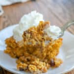 Warm pumpkin baked oatmeal topped with creamy cool whipped cream is a real breakfast treat! get the recipe at barefeetinthekitchen.com