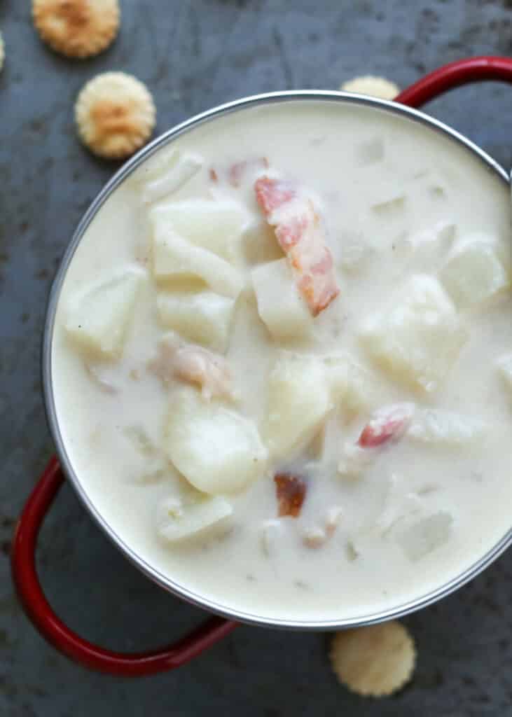 Chunky Clam Chowder is thick and creamy, filled with plenty of potatoes, clams, and bacon. Perfect for a weeknight dinner or a special occasion. - by Barefeet In The Kitchen