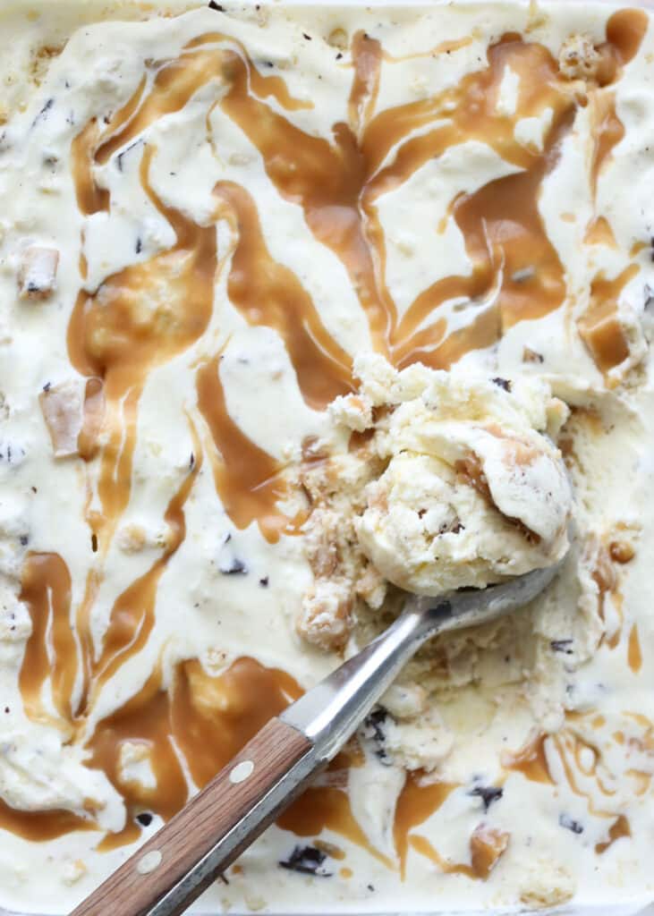 Millionaire Ice Cream Recipe - made with caramel swirled vanilla ice cream filled with chunks of shortbread, caramel, and chocolate.