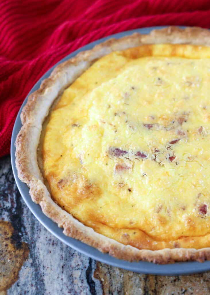 Cheesy Bacon Quiche is great for breakfast, lunch, or dinner! (make-ahead and freezer instructions included)