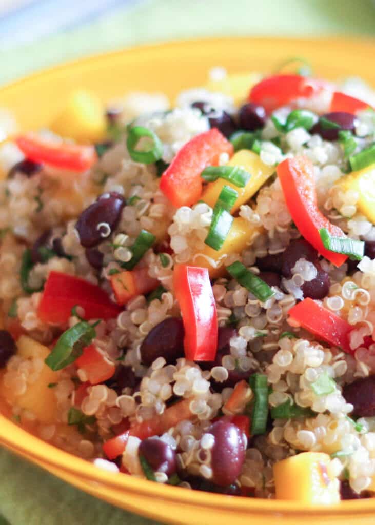 Mango Quinoa Salad is a colorful, flavorful dish for any meal! get the recipe at barefeetinthekitchen.com