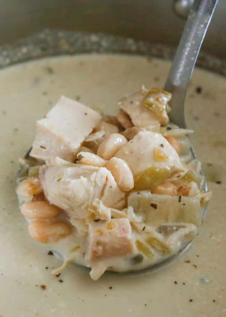 Creamy White Chicken Chili recipe that can be made in the crock-pot or on the stove - get the recipe at barefeetinthekitchen.com