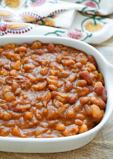 Slow-Cooker Mexican Baked Beans Recipe, filled with three different kinds of beans and plenty of spices. Get the recipe at barefeetinthekitchen.com