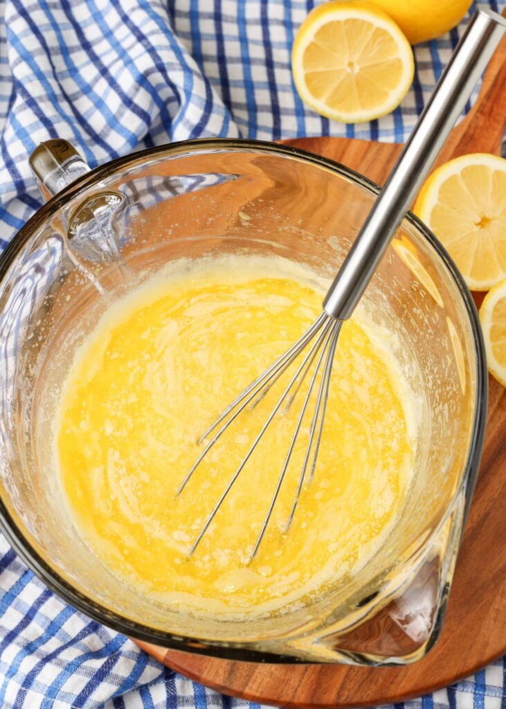lemon curd ingredients in bowl on board