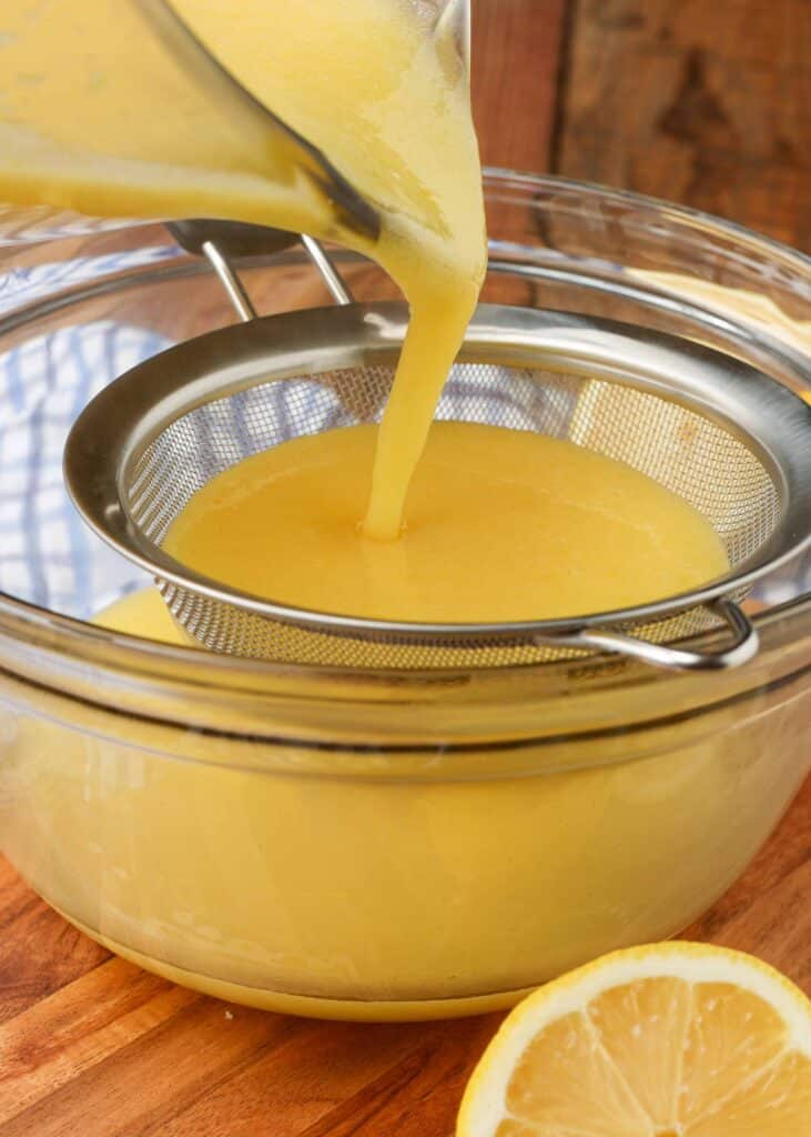 straining warm lemon curd