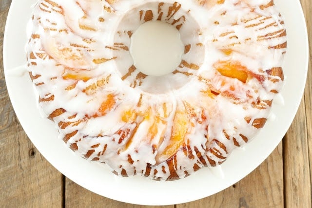 Summer Pound Cake with Caramelized Peaches and Almond Glaze - get the recipe at barefeetinthekitchen.com