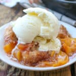 Southern Peach Cobbler is a summer dessert that we look forward to all year long - get the recipe at barefeetinthekitchen.com