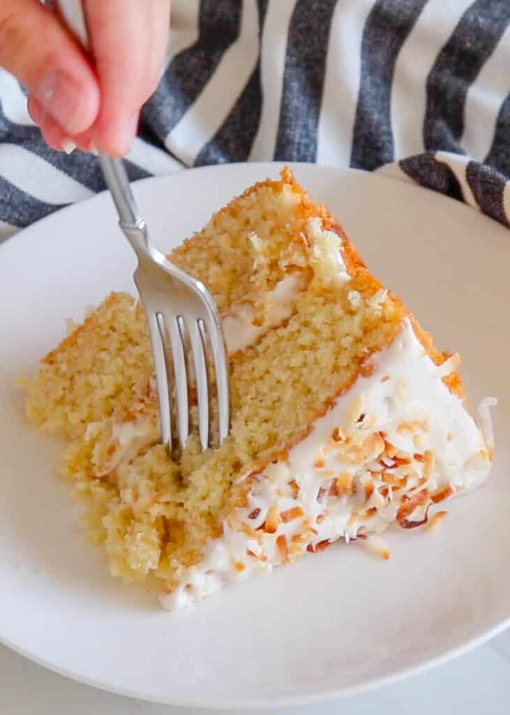 Tender Pineapple Cake with Fluffy Coconut Icing - get the recipe at barefeetinthekitchen.com