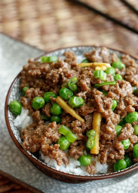 A plate of food with rice meat and vegetables, with Beef and Sauce