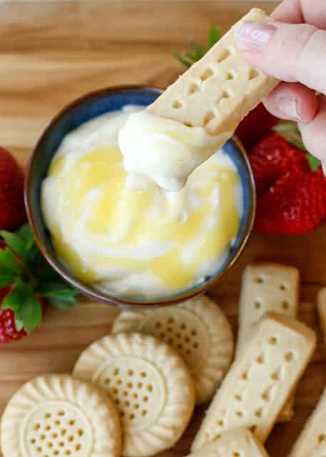 Creamy Lemon Dip with Shortbread and Strawberries is a light summery dessert that is perfect for sharing with friends or family. Get the recipe at barefeetinthekitchen.com