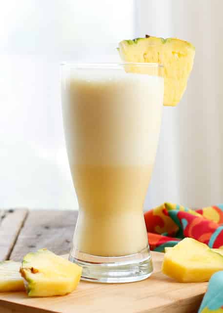 This Pineapple Orange Julius is a tropical twist on the classic Orange Julius drink and best of all you can make at home! - get the recipe at barefeetinthekitchen.com