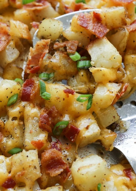 Crispy Cheese and Bacon Potatoes need to happen sooner than later! get the recipe at barefeetinthekitchen.com