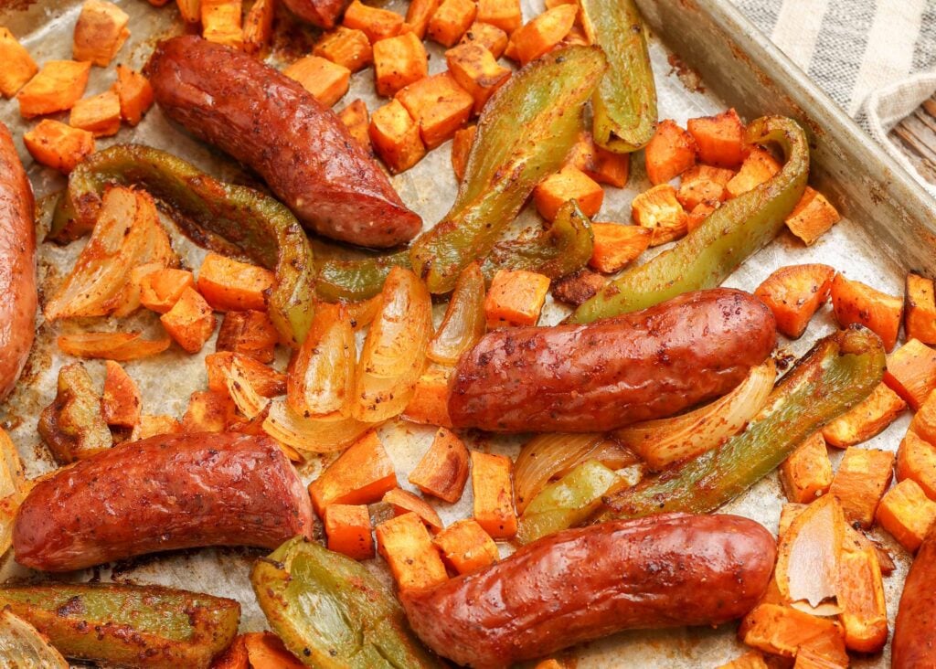 vegetables and sausage on metal tray