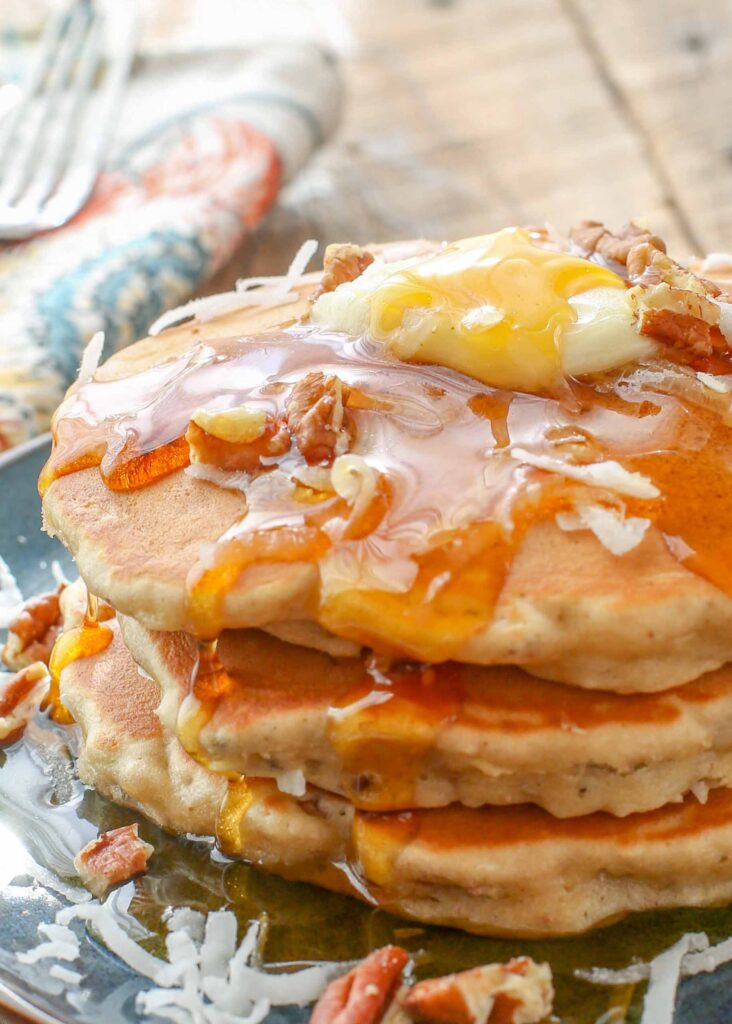 Banana, coconut, and pecans add up to a whole lot of deliciousness with these pancakes!