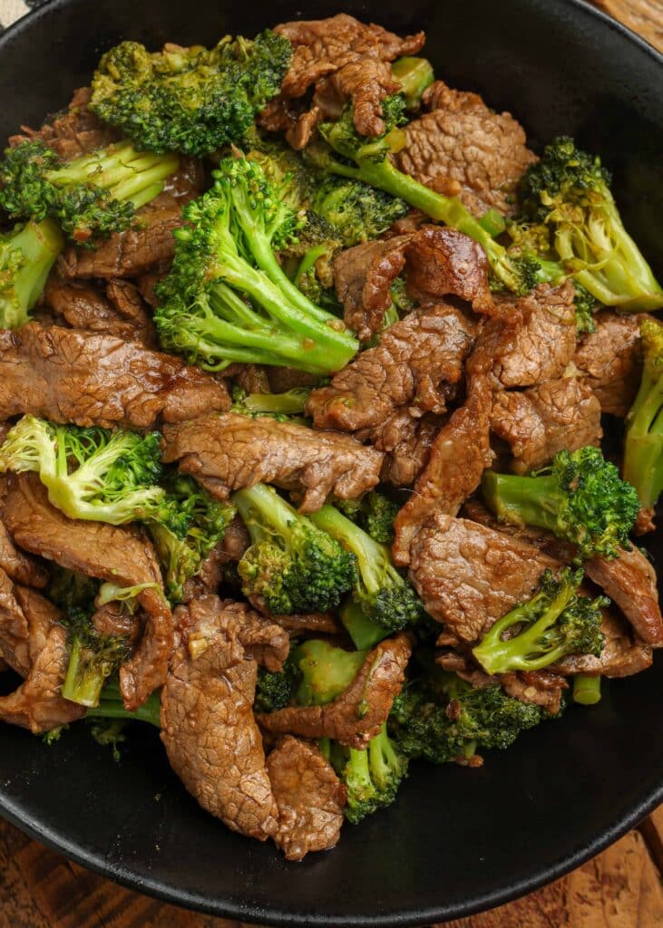 broccoli beef in black bowl