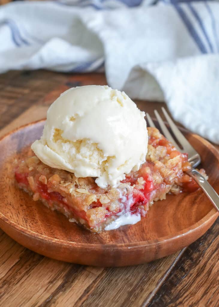 Strawberry Rhubarb Crunch is a summer favorite served with or without the ice cream! - get the recipe at barefeetinthekitchen.com