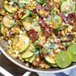 Skillet Mexican Street Corn with Squash and Kielbasa is a one-skillet dinner that comes together in no time at all. Get the recipe at barefeetinthekitchen.com