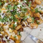 Pulled Pork Tater Tot Nachos disappear lightning fast! - get the recipe at barefeetinthekitchen.com