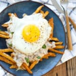 Crispy fries and melting cheese curds are topped with flavorful sausage gravy and an over-easy fried egg to make this Breakfast Poutine!