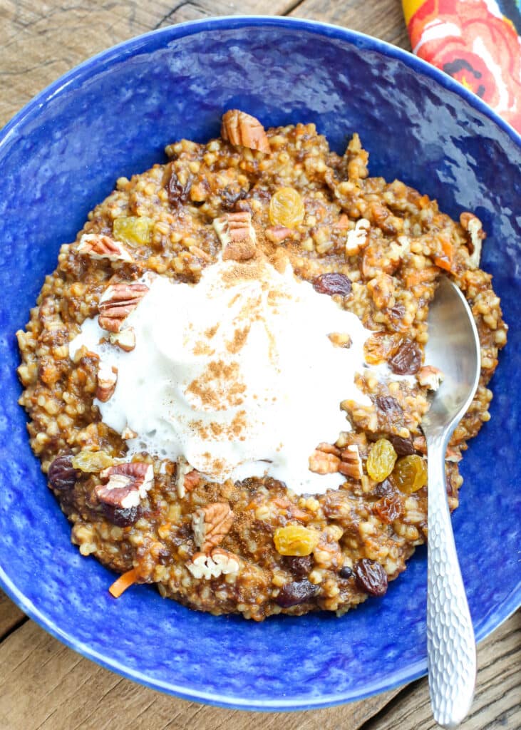 Carrot Cake Oatmeal topped with whipped cream is a breakfast treat! get the recipe at barefeetinthekitchen.com
