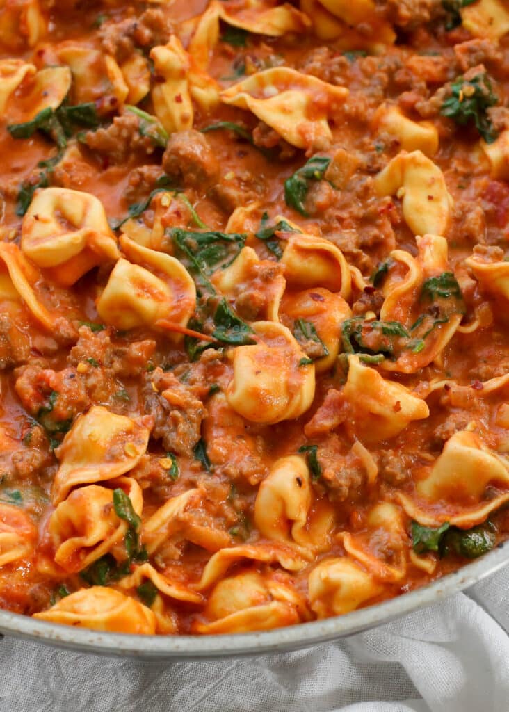 Sausage, Tortellini, and Spinach in a Creamy Tomato Sauce - get the recipe at barefeetinthekitchen.com