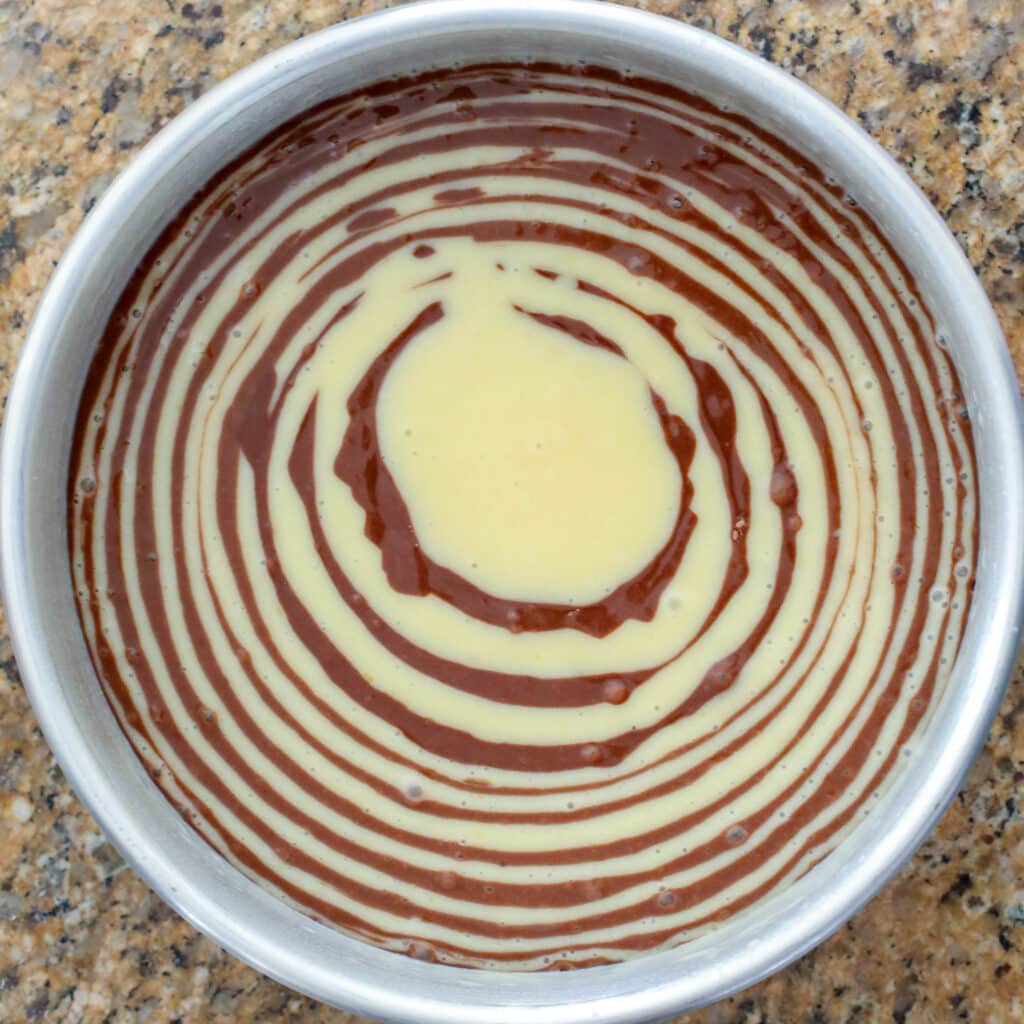 To make a Zebra Cake, just alternate scoops of batter when pouring it into the baking pan! get the recipe at barefeetinthekitchen.com