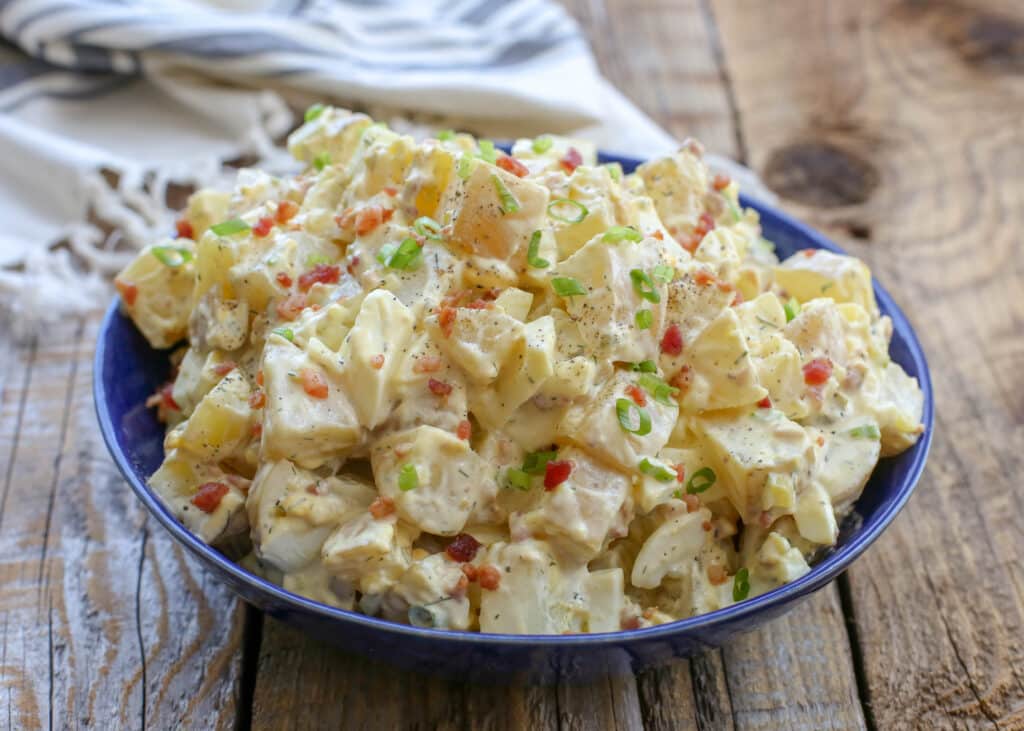 Dill Pickle and Bacon Potato Salad is a guaranteed win! get the recipe at barefeetinthekitchen.com