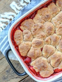 Strawberry Cobbler is a HIT for all your summer parties - get the recipe at barefeetinthekitchen.com