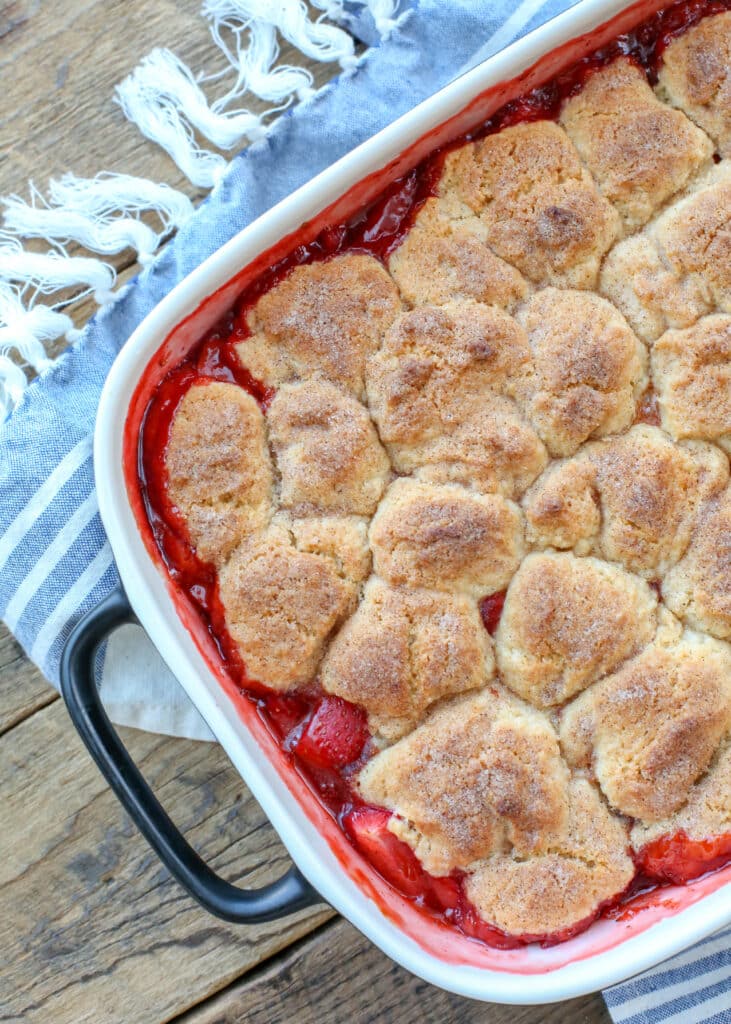 Strawberry Cobbler is a HIT for all your summer parties - get the recipe at barefeetinthekitchen.com
