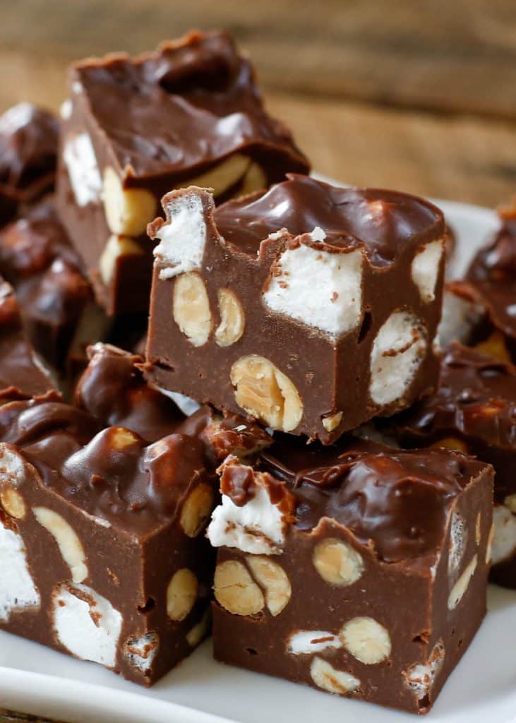 Rocky Road Fudge is a quick and easy five minute fudge recipe filled with clusters of peanuts and plenty of marshmallows! get the recipe at barefeetinthekitchen.com