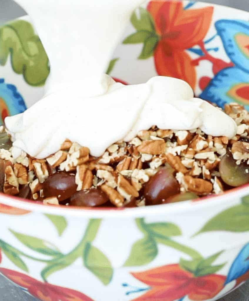 Grape salad topped with mildly sweetened sour cream dressing