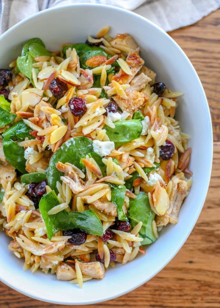 Spinach Orzo Salad with Cranberries, Almonds, and Goat Cheese - close up photo