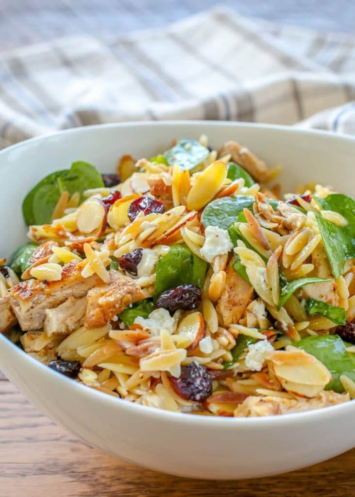 spinach salad with orzo, cranberries, and goat cheese