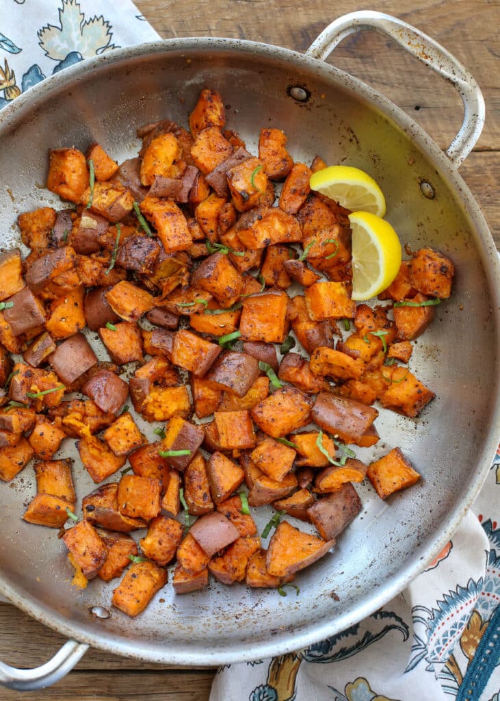 A bowl of food on a plate, with Potato and Sweet potato