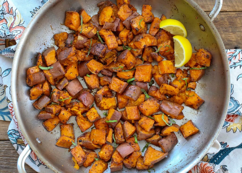 Lemon Butter Sweet Potatoes are irresistible straight from the pan - get the recipe at barefeetinthekitchen.com
