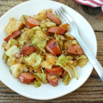 Cabbage and Sausage One-Pan Meal is a hearty dinner that everyone loves! get the recipe at barefeetinthekitchen.com